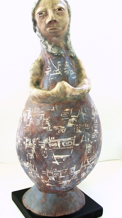 She Stands in a Circle of Stones